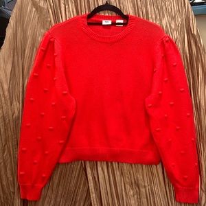 Levi’s brand pullover sweater with popcorn knit puff sleeves in red